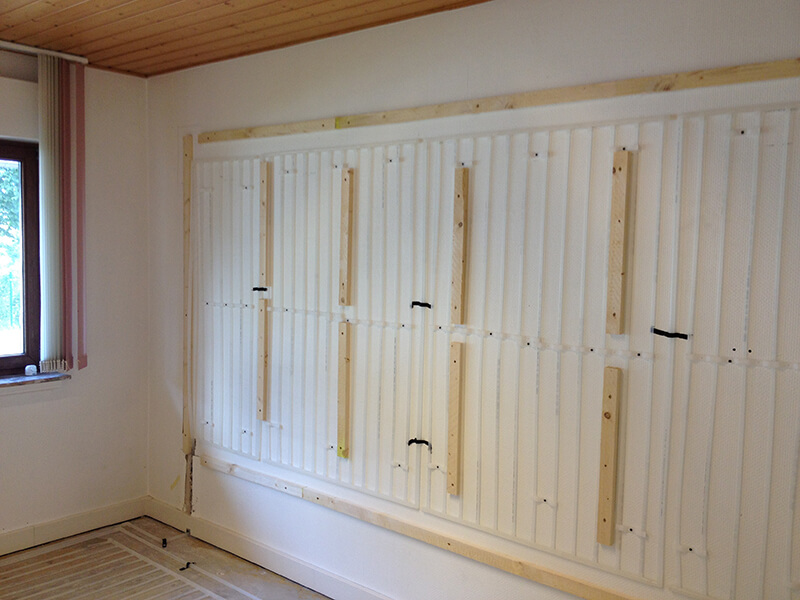 Wall heating with different dry constructions